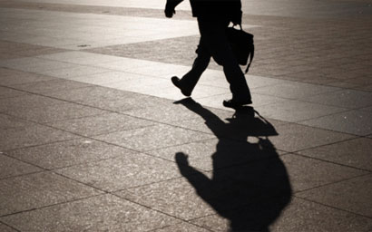 man-walking-with-shadow