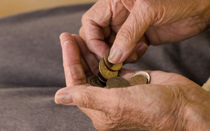 Pensioner counting coins